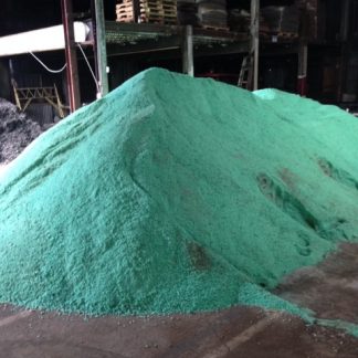 Pile of green Clearlane rock salt in bulk rock salt supplier distrubtion warehouse